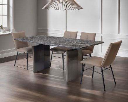 This 6 & 8 seater minimalistically designed dining table with grey marble top is an embodiment of contemporary chicness. This dining table in geometrical hexagonal base comes in glossy gunmetal finish in a contemporary design.

This sleek dining chair i