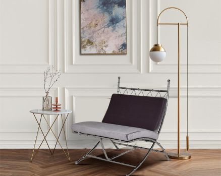Lounge chair with stool and decor light  upholstered in fabric with high polished stainless steel frame in bamboo design.
