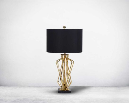 Table lamp in gold finish and marble base with a black fabric shade in ultra modern design.