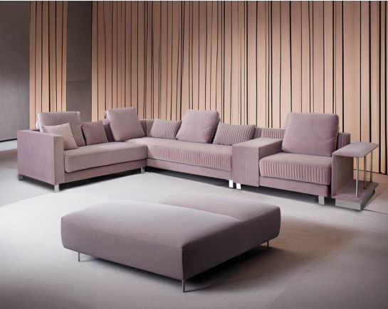 This luxurious L-shaped sofa is very sleek, spacious, and provides ample comfort with storage in the handrest in a modern contemporary style.