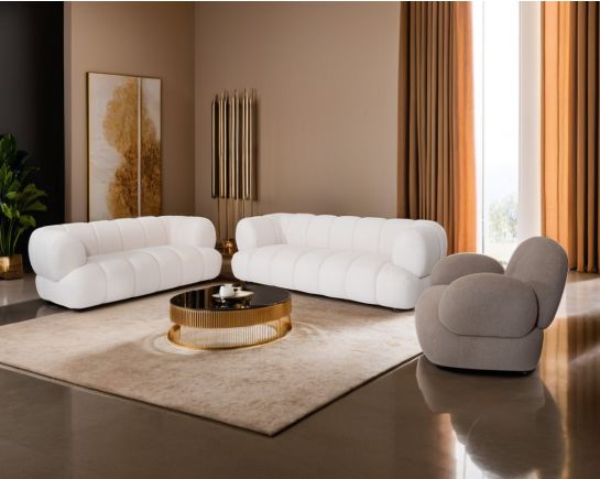This sinuous & soft 3+2 seater sofa exudes a sense of calm & ease, upholstered in high-quality boucle fabric with wooden legs.