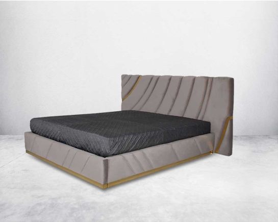 This elegant stainless steel bed is crafted in a gold finish stainless steel inlay trim & upholstered & quilted in soft luxe fabric in modern design side view