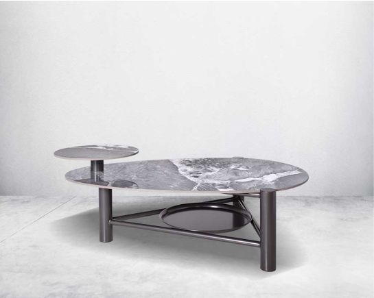 Coffee table with two layers in geometric design with sintered stone top and titanium plated stainless steel base in a geometric design.