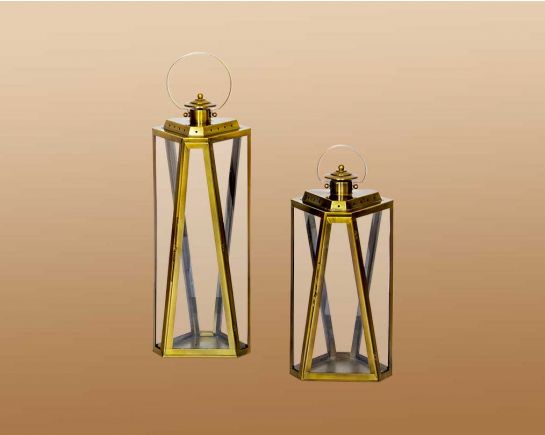 Lantern with clear glass and brass plated stainless steel.