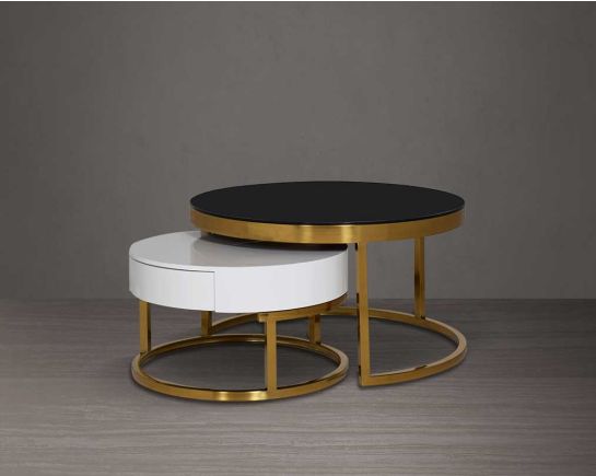 This round coffee table set is an embodiment of modern glamour. One comes with a black tempered glass top and the other in a glossy white wood top with drawer. The base is in a shiny fingerless gold plated stainless steel finish in geometric design.