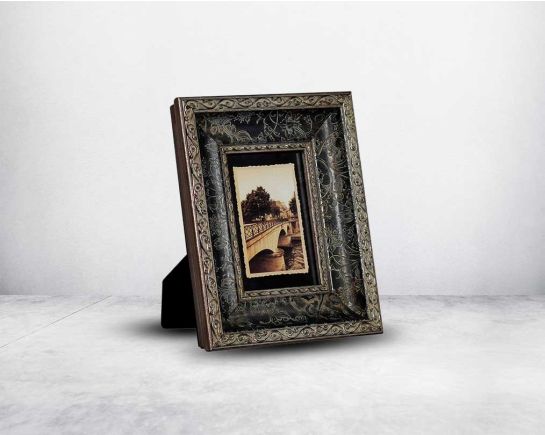 Photo frame in wood with stone embellished decorative frame in modern classic design.