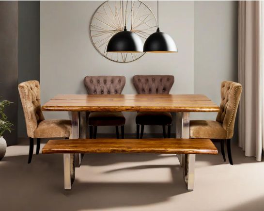 Large 6 seater rectangle dining table in solid acacia wood in light walnut with nickel coated stainless steel base in glossy finish. Dining chair upholstered in fabric with tufted back and birchwood legs.