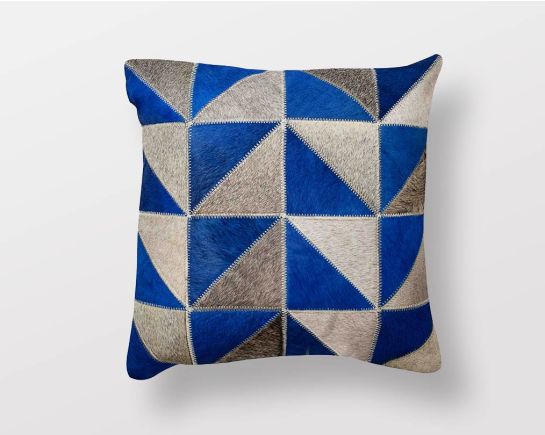 Blue and grey hair on & a leather cushion.
