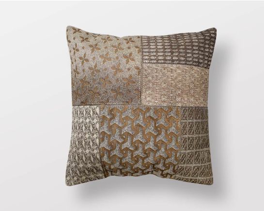 Brown & Grey hair on & leather cushion.