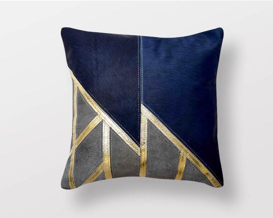 Blue-grey & gold hair on a leather cushion.
