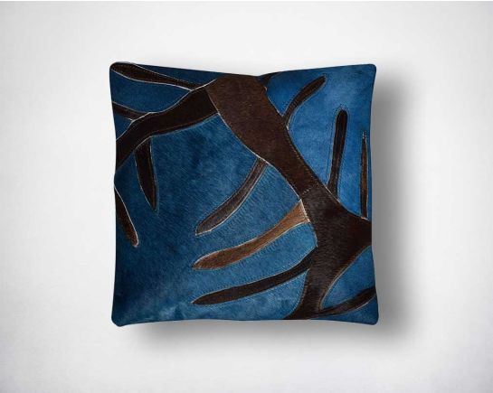 Navy blue and brown hair on a leather cushion.