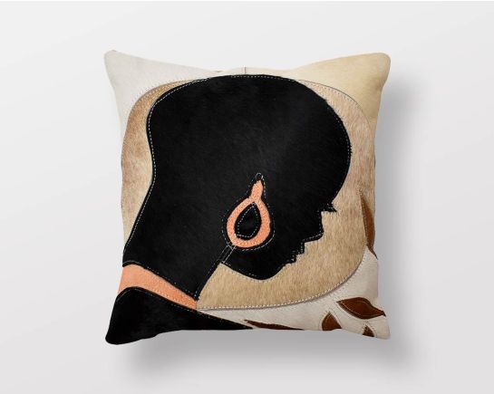 Beige, black & tan hair on & leather cushion.