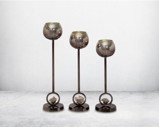 "Pillar goblet candle holder in brown lustre glass with nickel-plated textured aluminum decorative base with a zeolite stone motiff "