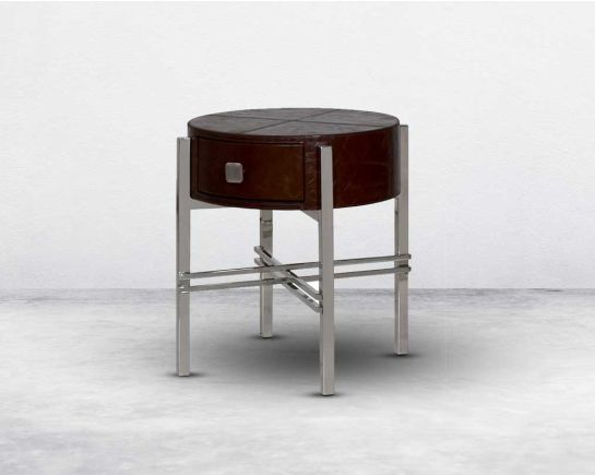 "Round end table with vintage brown luxurious leather with one drawer with stainless steel legs in modern design. "