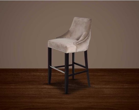 Bar chair upholstered in fabric with buttoned tufted back and silver rivets, the stool has a stainless steel front bar as a foot rest with legs in dark vintage brown wood