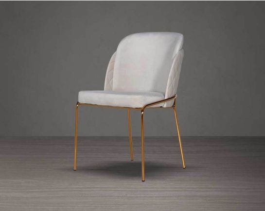 Designed chair with criss-cross stitch padded fabric in gold finish stainless steel legs in contemporary design.