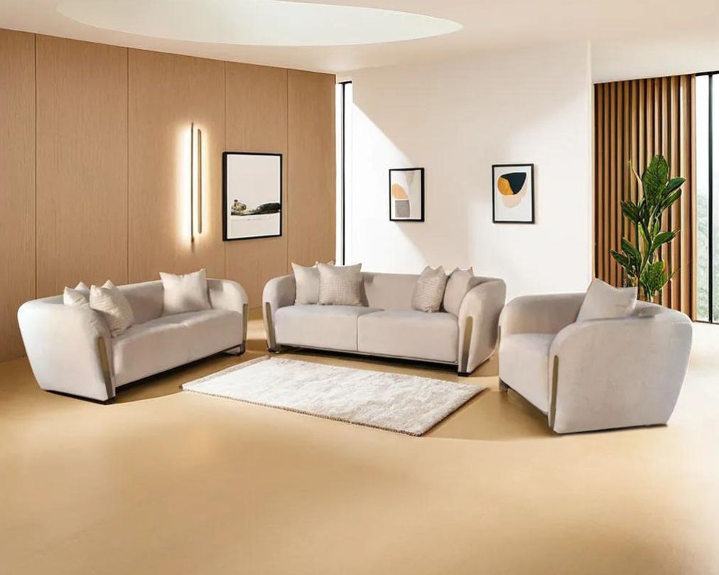 This 3+2+1 sofa set in high-quality fabric is an epitome of luxury, an astonishing piece of modern design. The sofa's gently curved back with its distinctive flared padded arms wrap the seat in a sweeping embrace.