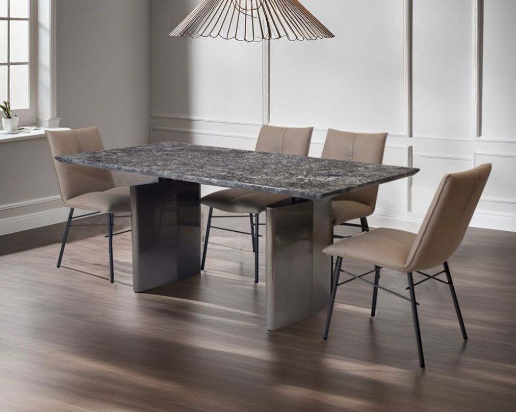 This 6 & 8 seater minimalistically designed dining table with grey marble top is an embodiment of contemporary chicness. This dining table in geometrical hexagonal base comes in glossy gunmetal finish in a contemporary design.

This sleek dining chair i