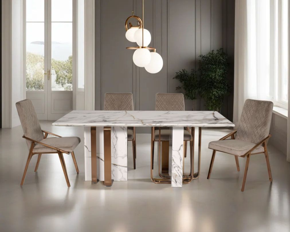 This glorious 6 & 8 Seater rectangular dining table with white marble top comes with wood & high polished matt rose gold plated stainless steel geometrical base. 